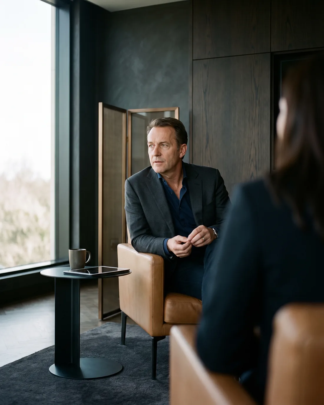 A senior CHRO reviewing the work in a calm Miami boardroom